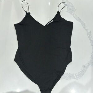 Black soft bodysuit size large